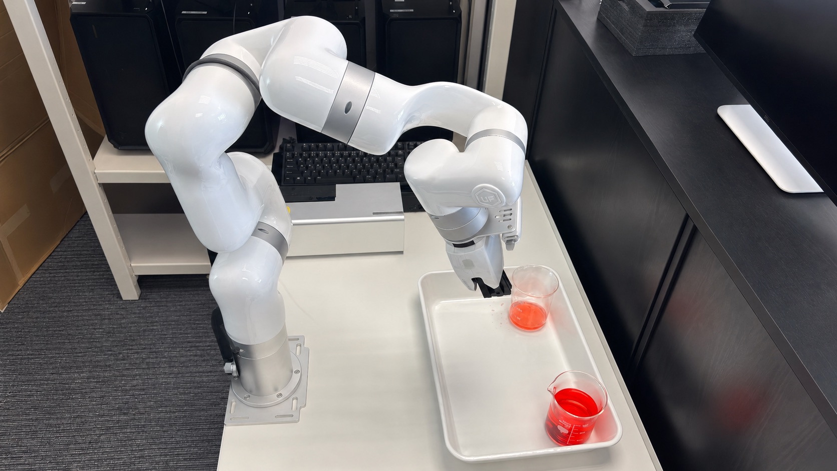 Collaborative robot handling a beaker